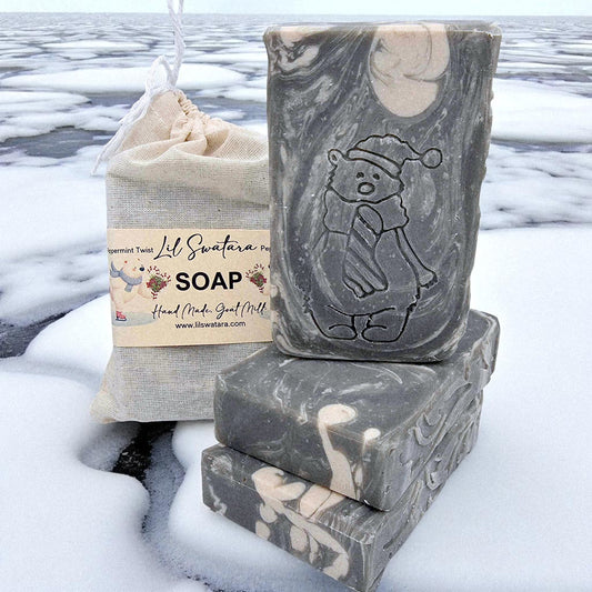 Full-size peppermint goat milk soap bar with creamy lather, frosted vanilla swirls, and spun sugar shimmer. Handmade, cold-processed, and perfect for winter gifting.