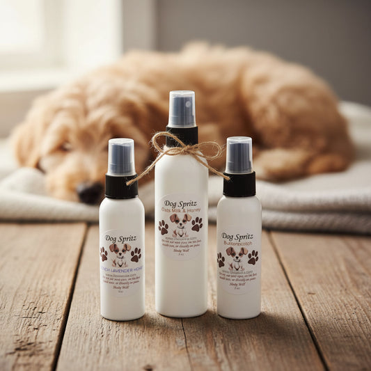 Dog freshening spray bottles displayed on wood with a relaxed dog laying in the background, Lil Swatara Soap branding.
