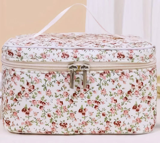 Floral spa gift set with handmade goat milk soap, face cream, pink sugar-type body spray, and soap samples in a zippered cosmetic bag with shrink wrap and ribbon