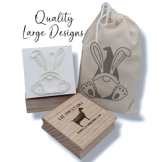 Bunny-ear gnome soap stamp with recessed design on red oak wood base, 57×48 mm.