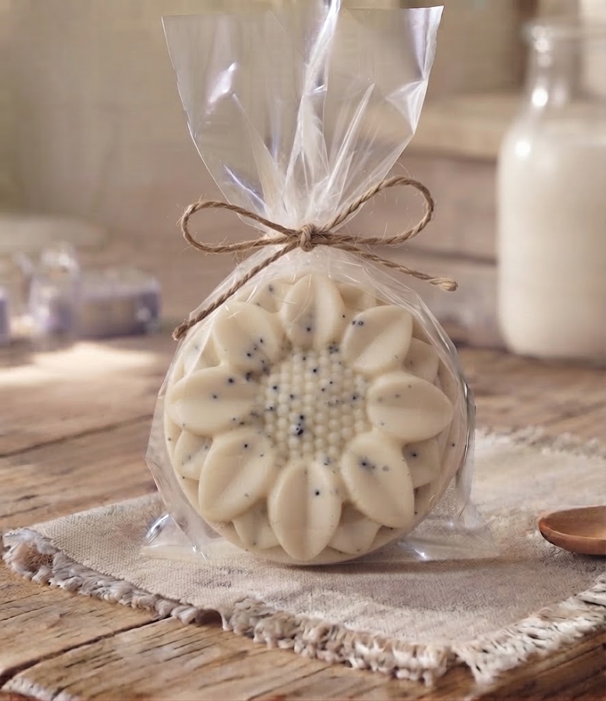 Exfoliating goat milk soap puck wrapped in clear packaging with twine, handmade on a Pennsylvania homestead.
