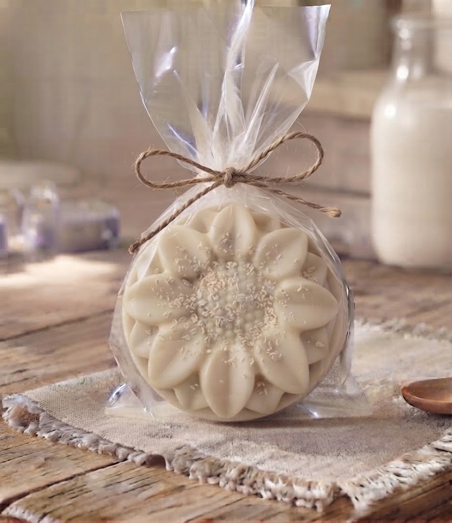 Exfoliating goat milk soap puck wrapped in clear packaging with twine, handmade on a Pennsylvania homestead.