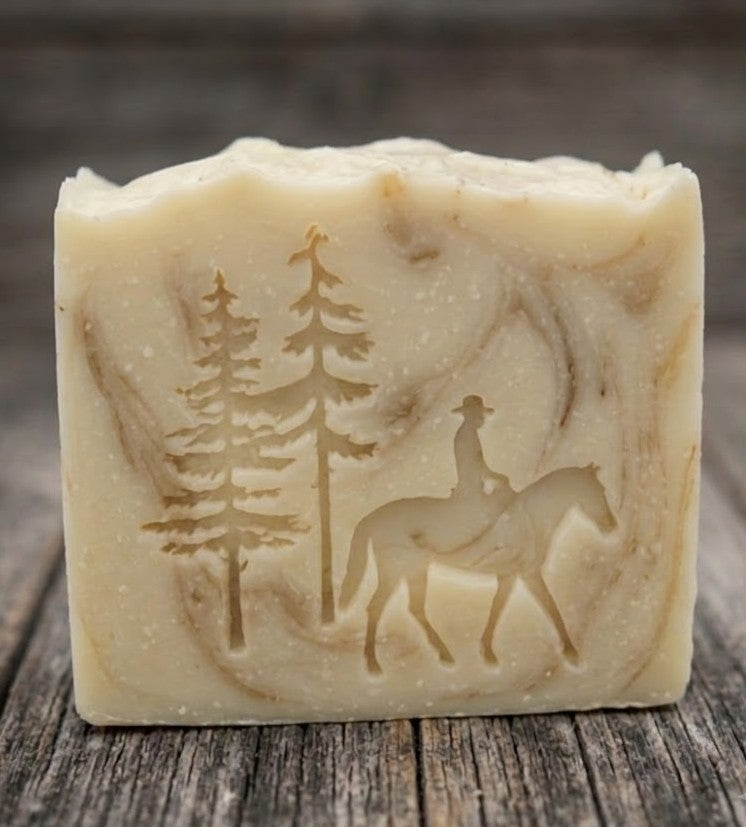 LARGE SOAP STAMP – Cowboy Horse Pines Western Design Creates LARGE, crisp impressions featuring a cowboy on horseback framed by rugged pine trees, perfect for western soaps, ranch themed artisan batches, country market collections, and outdoor inspired seasonal bars.
