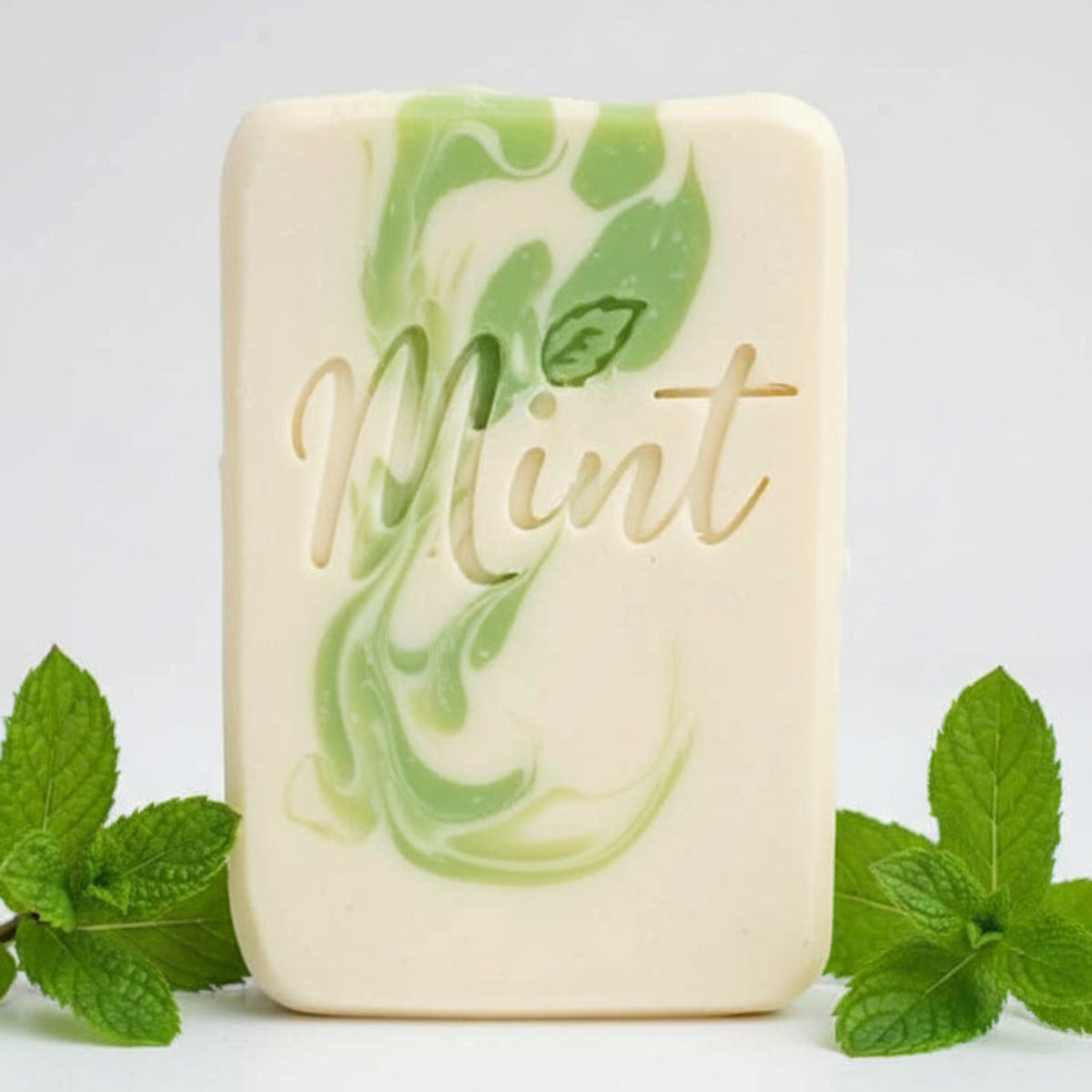 LARGE SOAP STAMP – Mint Herbal Botanical Leaf Word Design that Creates LARGE, crisp Mint impressions with a mint leaf forming the “i.” Ideal for herbal soaps, botanical blends, spa‑themed batches, and artisan gift sets.