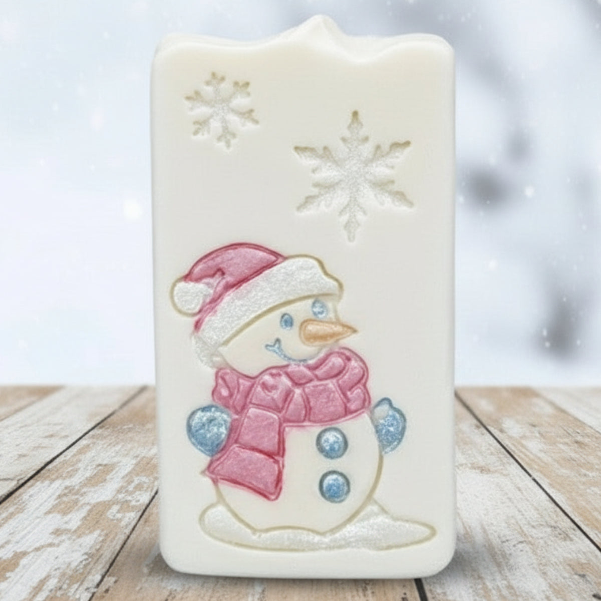 goat milk soap after stamping with a soap stamp of snowman and snowflakes from lil swatara soap 