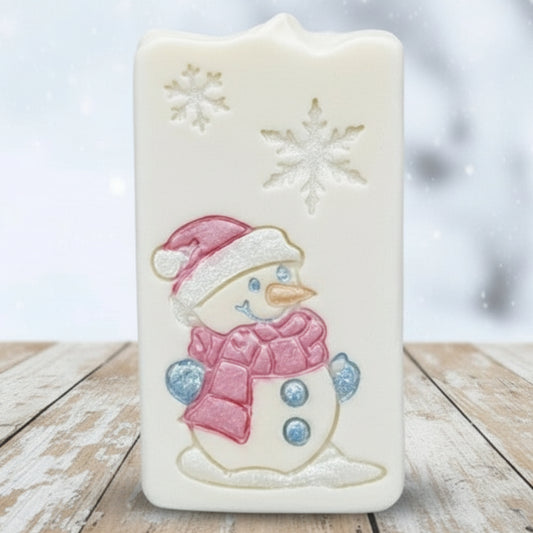 goat milk soap after stamping with a soap stamp of snowman and snowflakes from lil swatara soap 