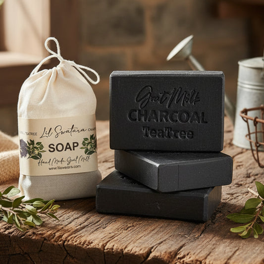 Three bars of charcoal soap with a drawstring bag labeled 'Lil Swatara Soap made on the homestead