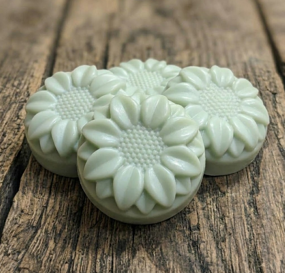 Handcrafted goat milk tallow shampoo flower bar with detailed petals and creamy lather.