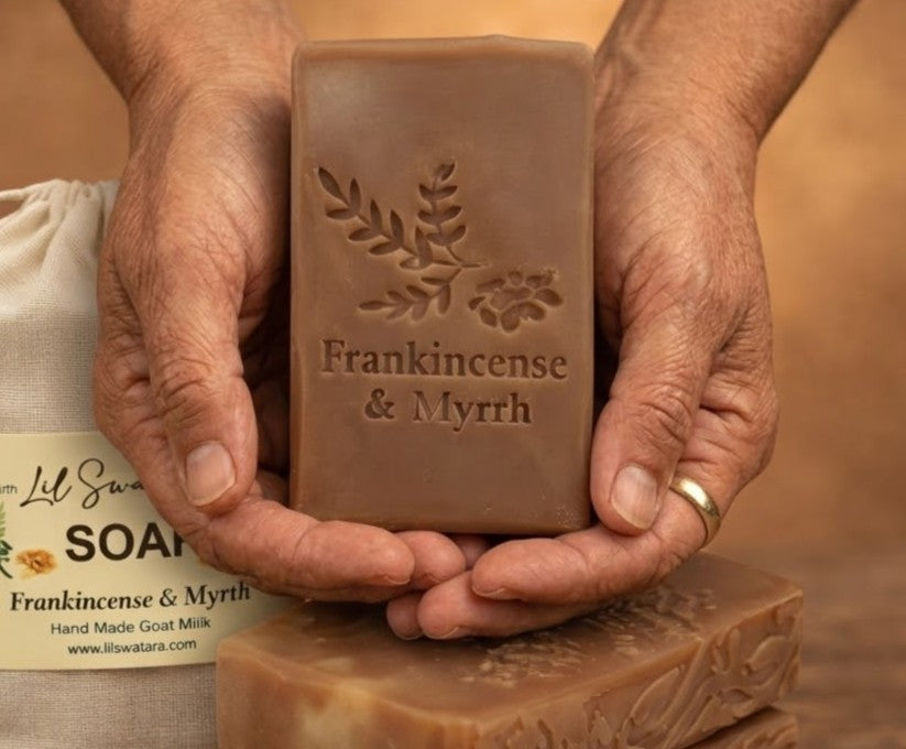 Frankincense & Myrrh tallow goat milk soap bars stacked with muslin sack on rustic wood surface, handcrafted by Lil Swatara Soap.