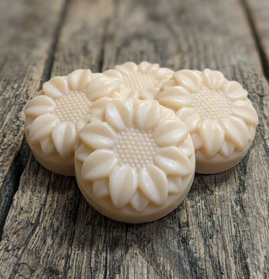 Handcrafted goat milk tallow shampoo flower bar with detailed petals and creamy lather.