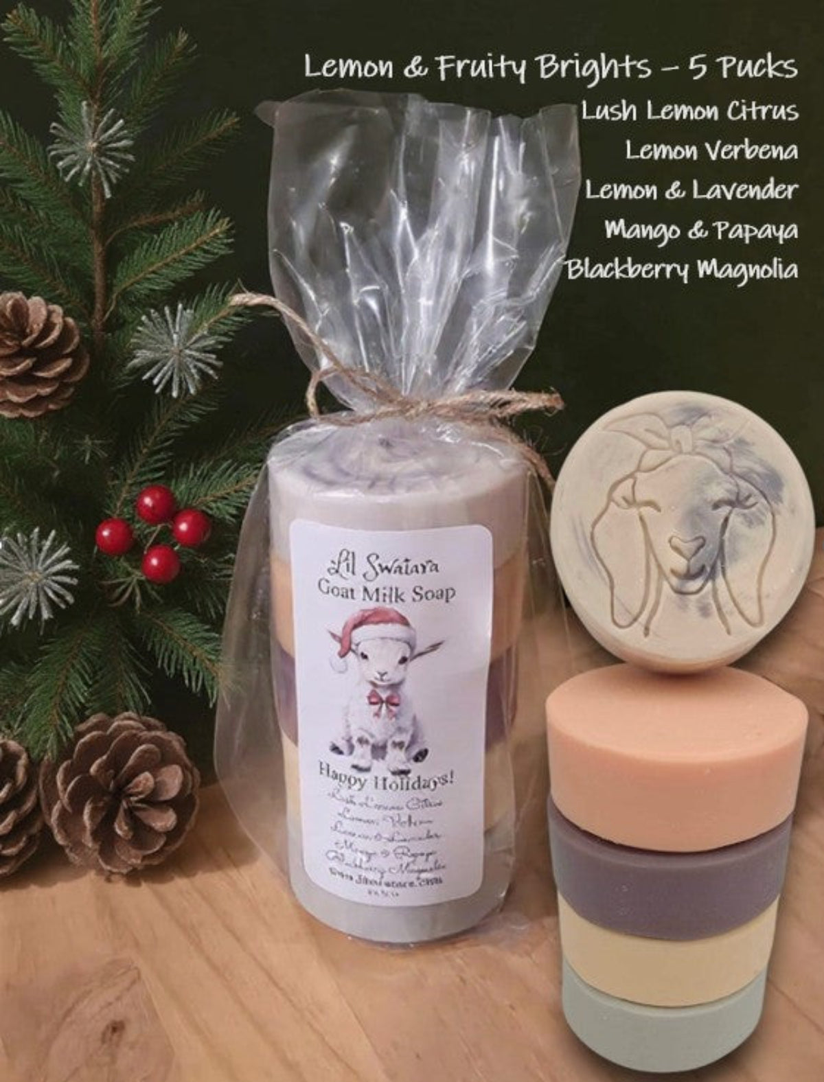 Display of five goat milk soap pucks in citrus and fruit-inspired colors, perfect for joyful holiday gifting.