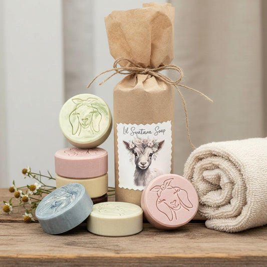 Goat milk soap puck set in clear bag with scent tag, wrapped in kraft paper for gifting, showing assorted handcrafted pucks in natural colors.