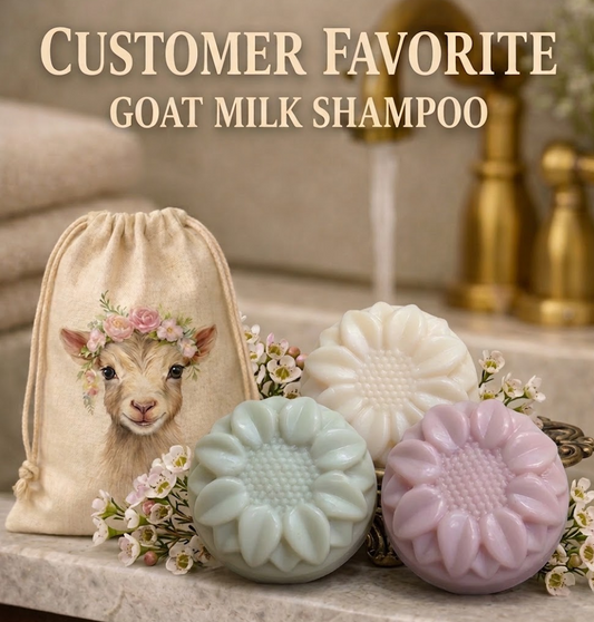 Group of handcrafted goat milk tallow shampoo flower bars in pastel colors with a goat logo bag and small white flowers. Customer favorite!