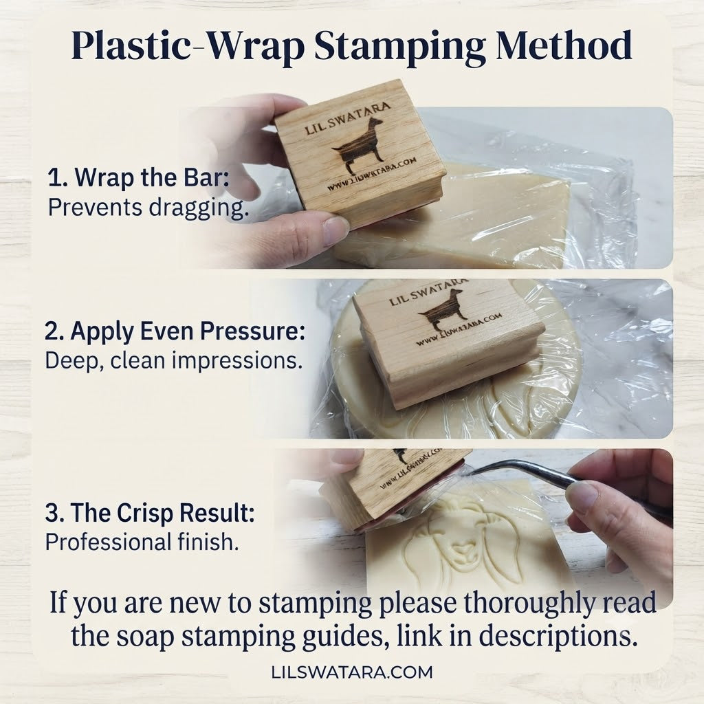 Hand using a wooden Lil Swatara Soap stamp on a plastic‑wrapped soap bar showing the three-step plastic-wrap stamping method for clean, professional impressions.