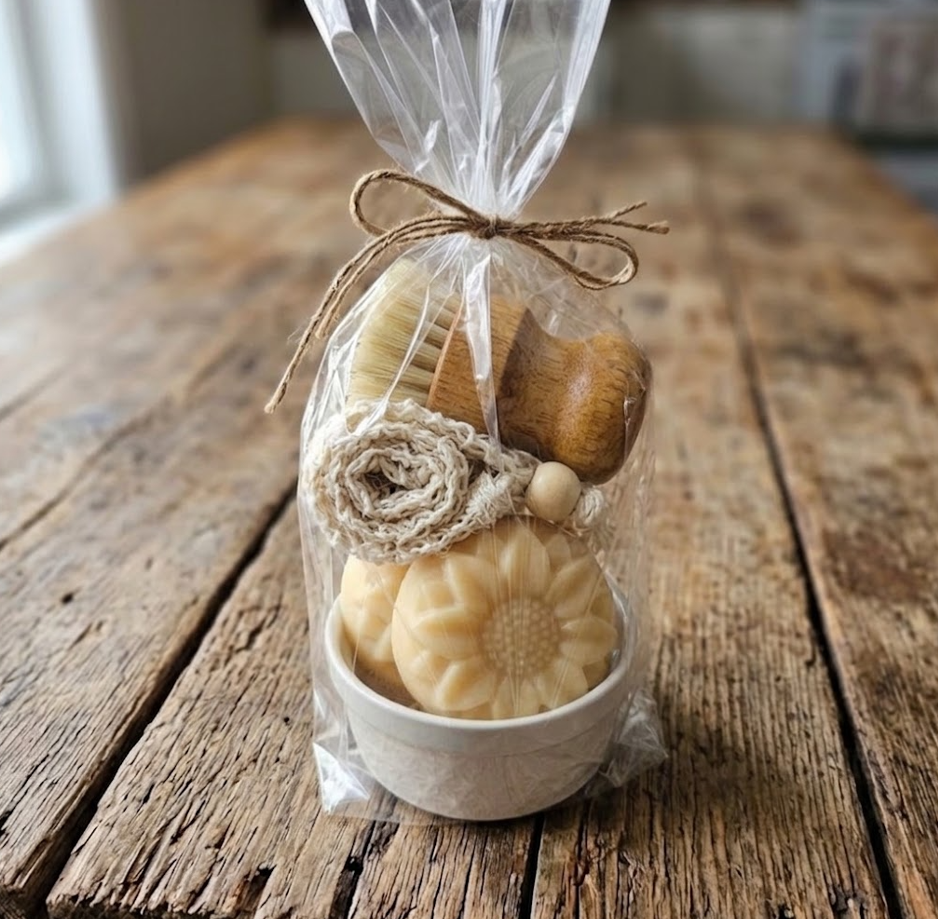 Natural essential oil goat milk soap gift set with flower soap, wooden brush and washcloth in ceramic bowl