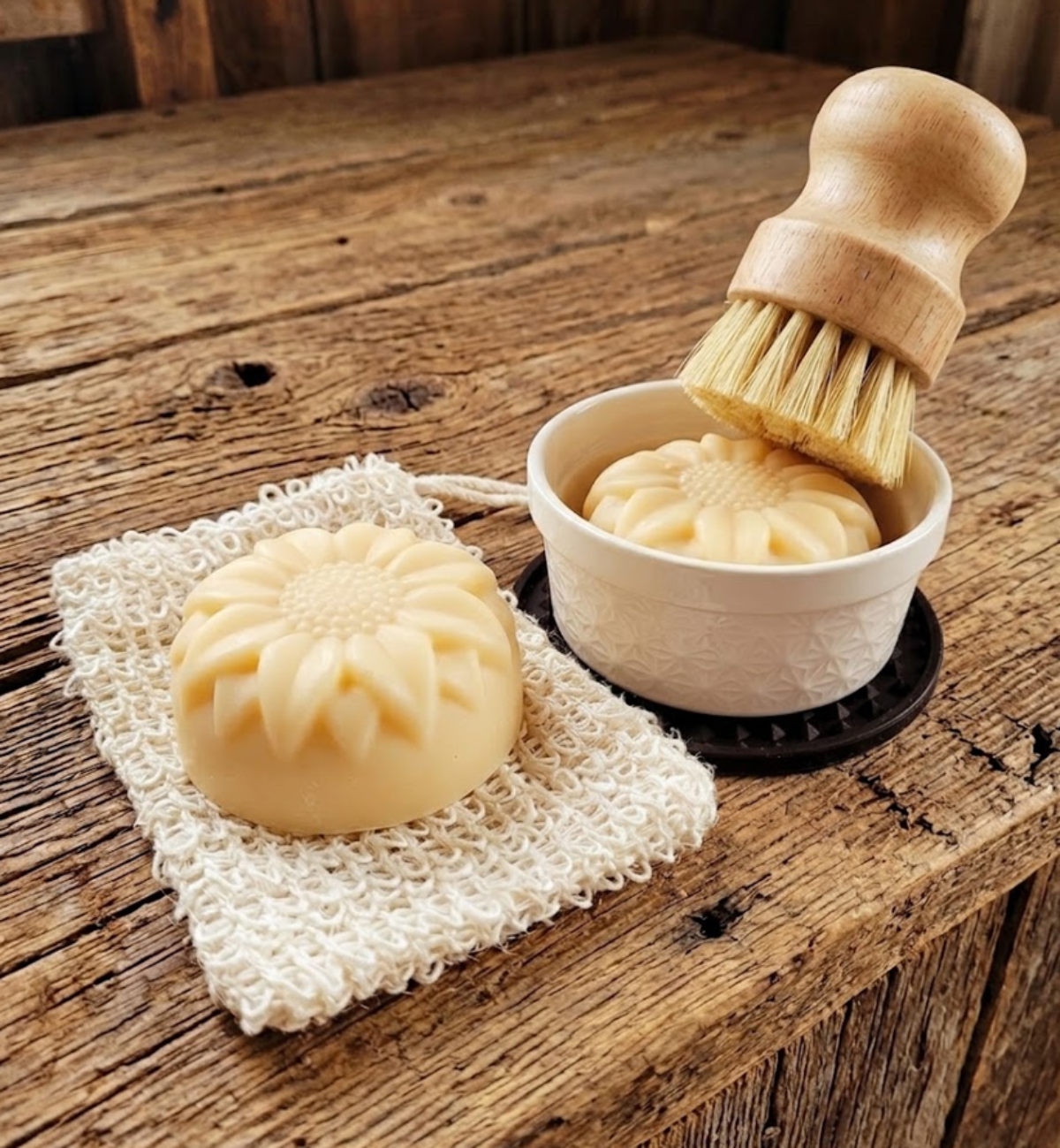 Natural essential oil solid dish soap puck with wooden dish brush for zero waste kitchen cleaning