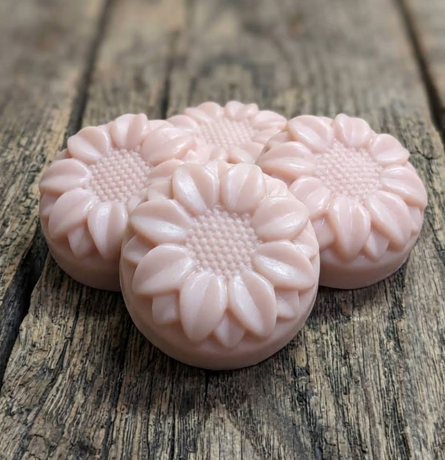 Handcrafted goat milk tallow shampoo flower bar with detailed petals and creamy lather.