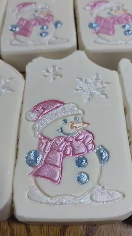 Snowman-themed soap in clear packaging with a tag on a white background Jasmine Honeysuckle goat milk soap