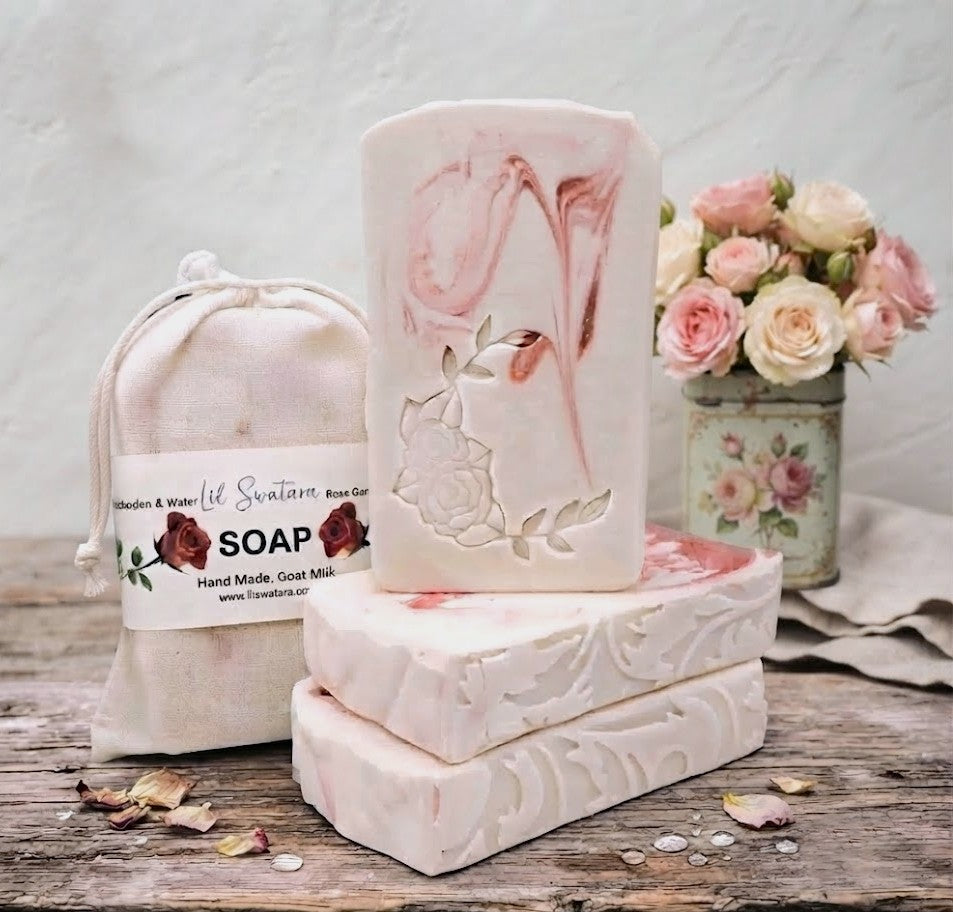 Rose Garden & Water goat milk soap bar with creamy rose swirls, floral embossing, and muslin bag in a soft garden setting.