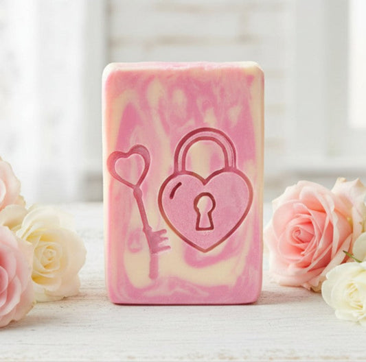 Wooden soap stamp with heart lock and key design, perfect for romantic and love-themed handmade soaps.