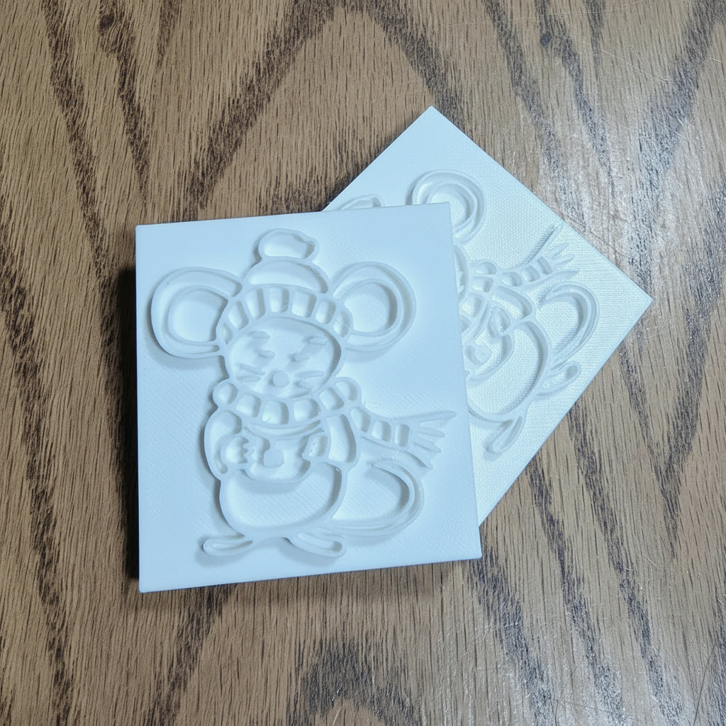 Mouse soap stamp with cozy winter details — bundled in a hat, scarf, and mittens, holding a warm mug. 3D printed in high-quality PLA with a 60×56mm impression size.
