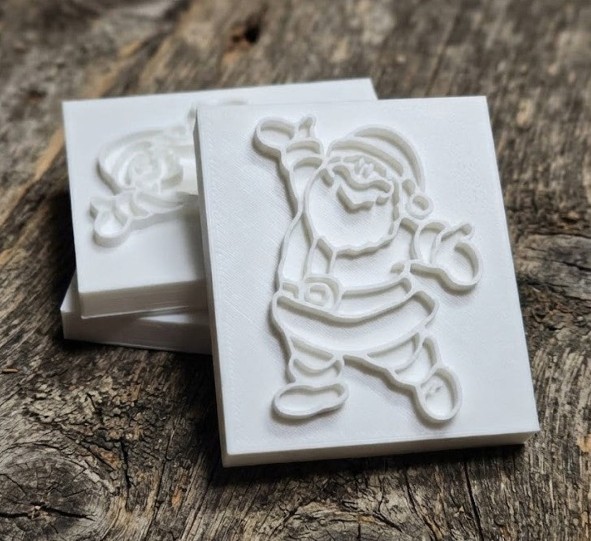 Happy Santa soap stamp with 66×46 mm recessed design, precision 3D printed PLA.