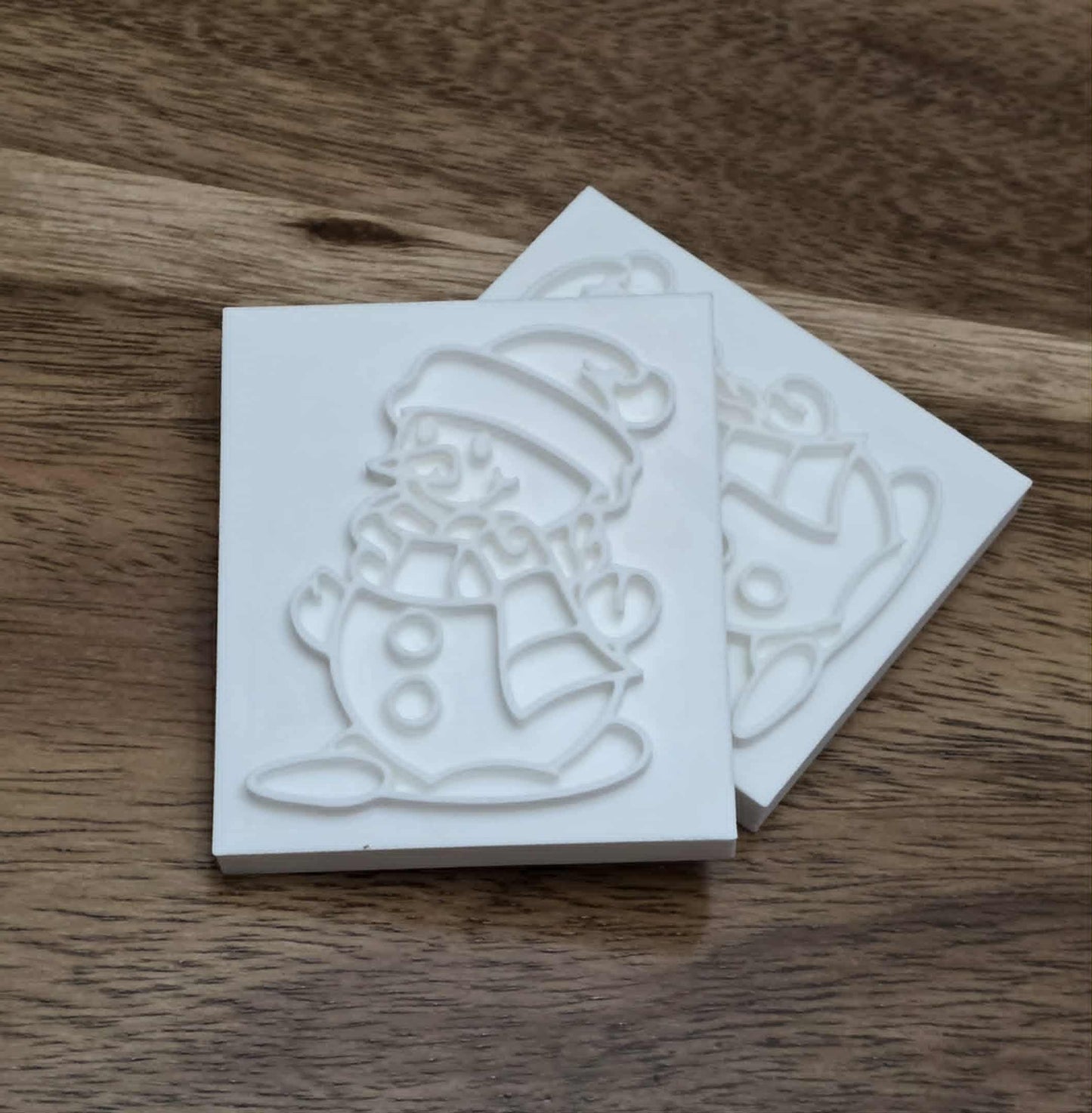 Snowman soap stamp with festive winter design, embossed snowman wearing hat and scarf, 3D printed polymer, 61x51mm impression for handmade Christmas soaps.