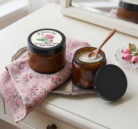 Volcanic Micro Polish Face Crème in amber glass jars with creamy goat milk facial polish displayed on a soft pink towel.